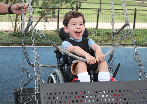 APA - Child Swinging at All Abilities Park