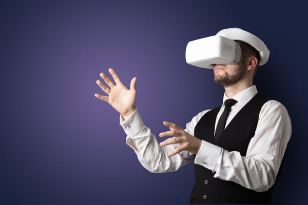 Businessman with white vr glasses in an empty room with no wallpaper