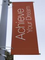 Motivational banner on campus of community college Achieve Your Dream