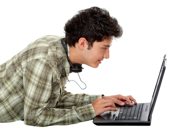 Young man with a laptop isolated over a white background